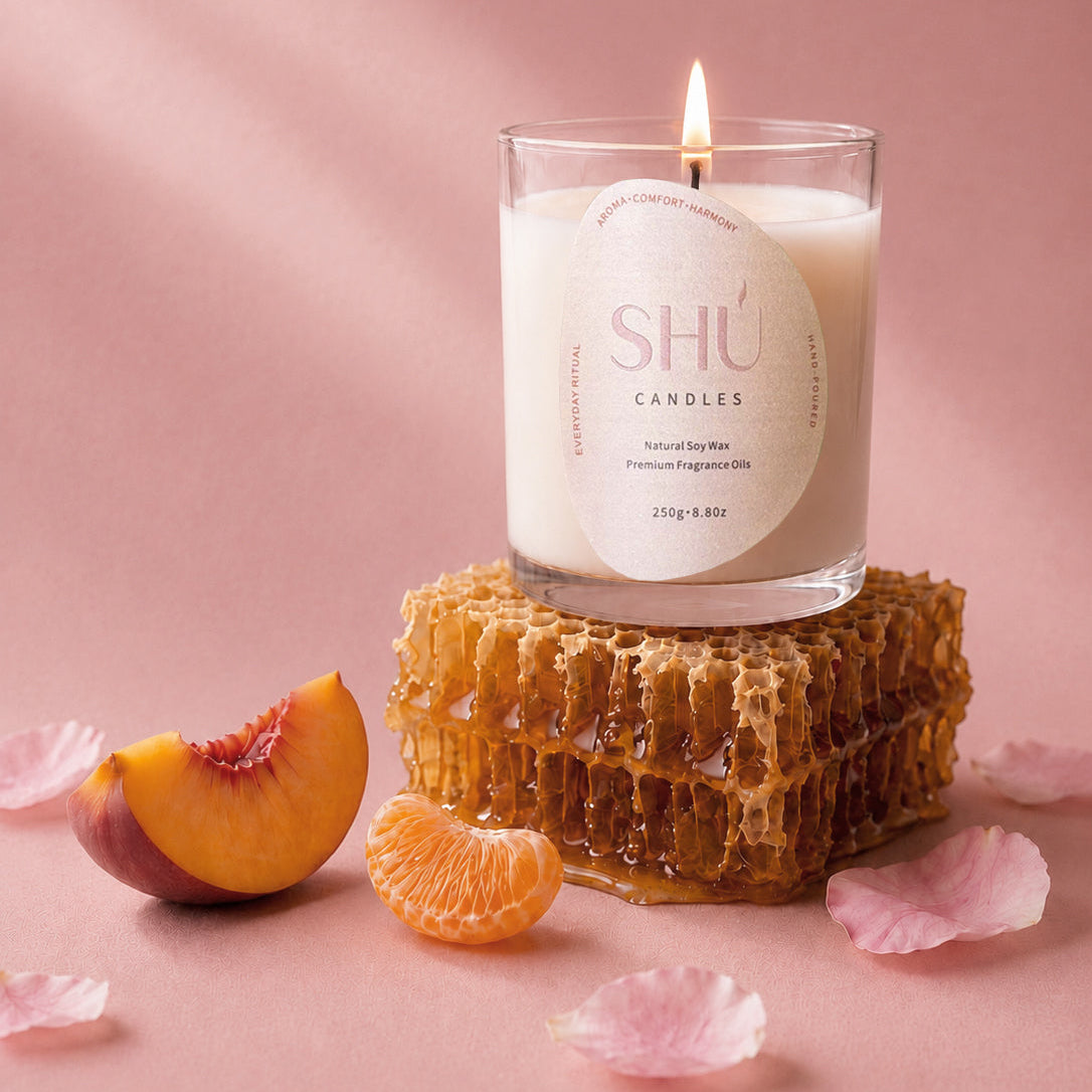 Nectarine Silk soy candle in clear glass with blush label, SHU Candles
