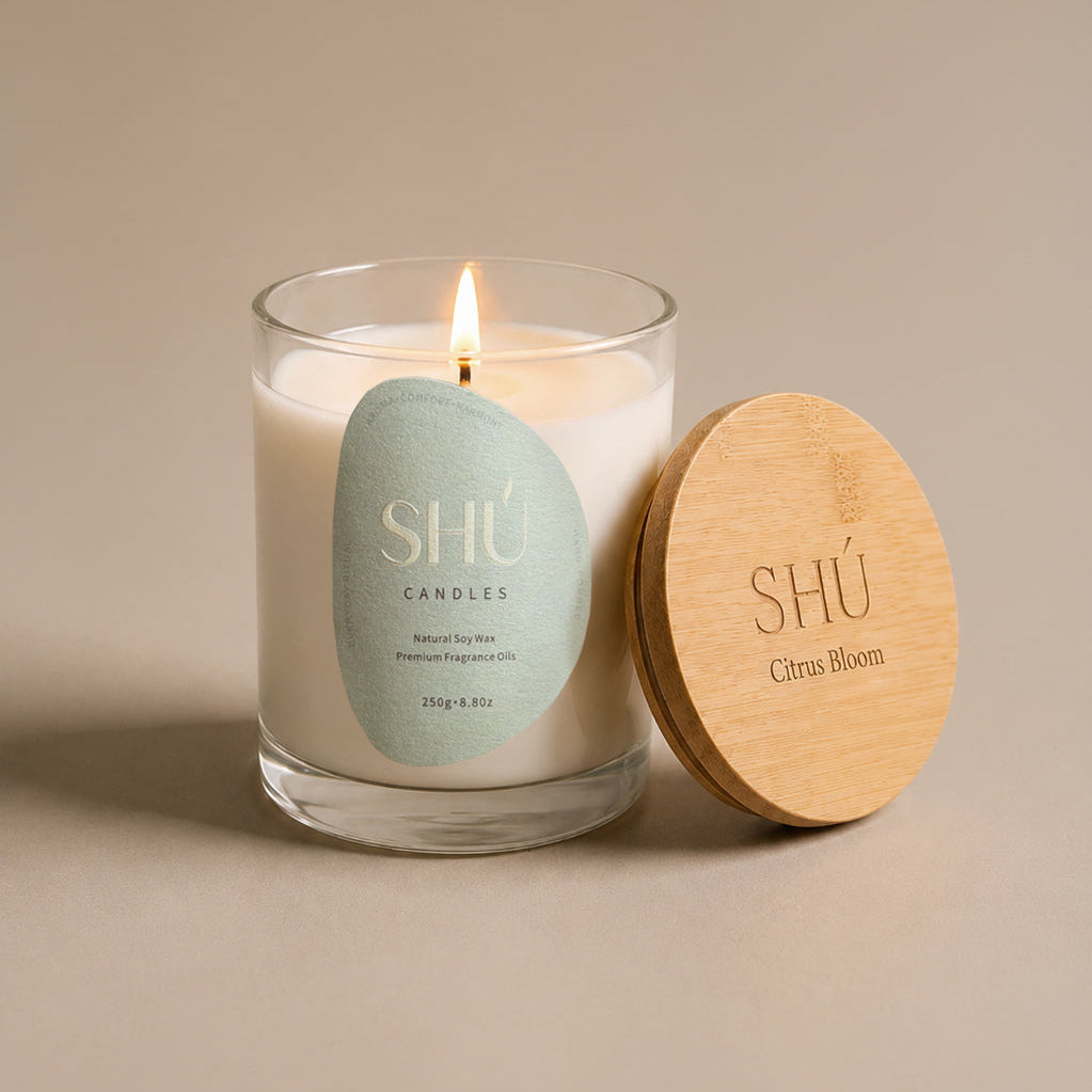 Citrus Bloom soy candle in clear glass with sage green label, SHU Candles