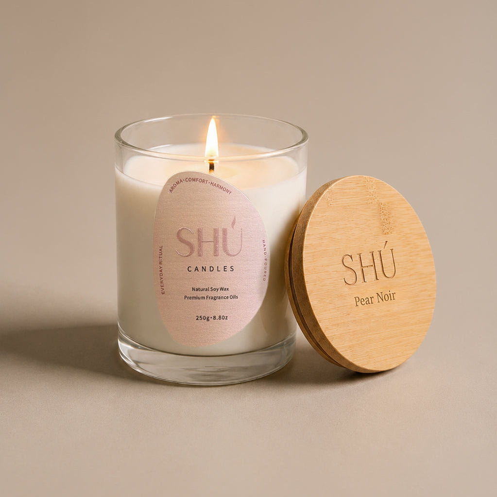 Pear Noir soy candle in clear glass with blush label, SHU Candles